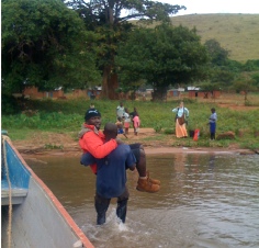 The small boat gets close to shore, the porter takes over from there